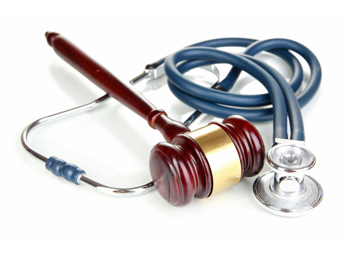 A close up picture of a hammer and a stethoscope